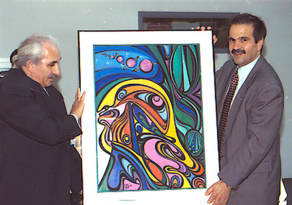 Frid presents painting to NASA